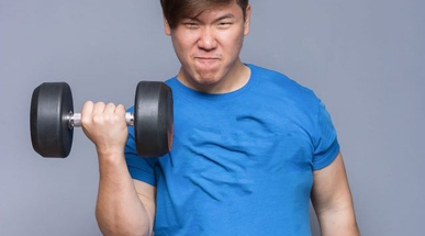 A young man lifting weights.jpg