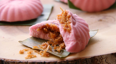 tutu-kueh-with-sweet-coconut-on-wooden-block.jpg