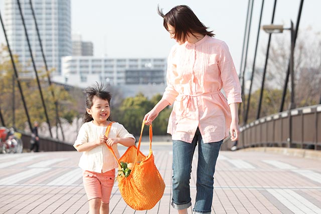 Mother bringing her child out for a walk at various park connectors a few times a week.