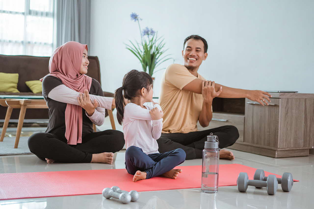 Parents exercising with their child