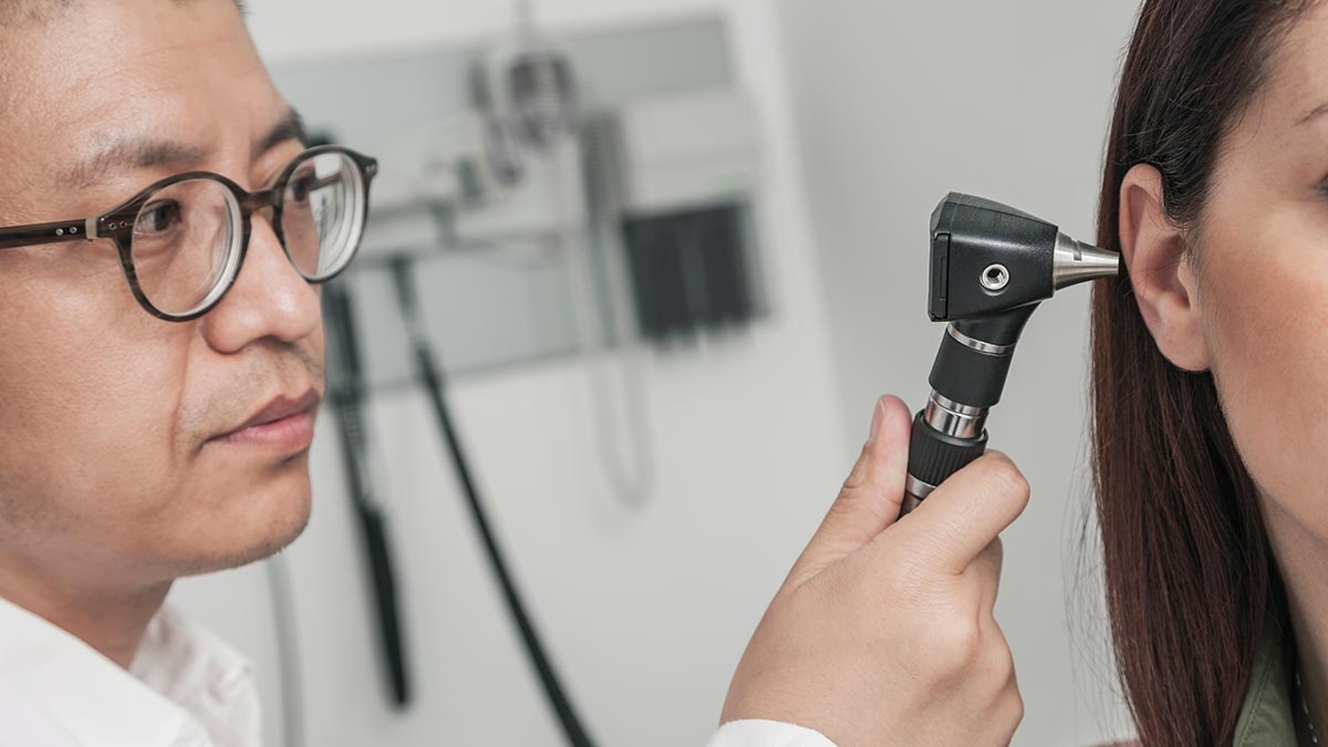 close-up-of-doctor-checking-patients-ears.jpg