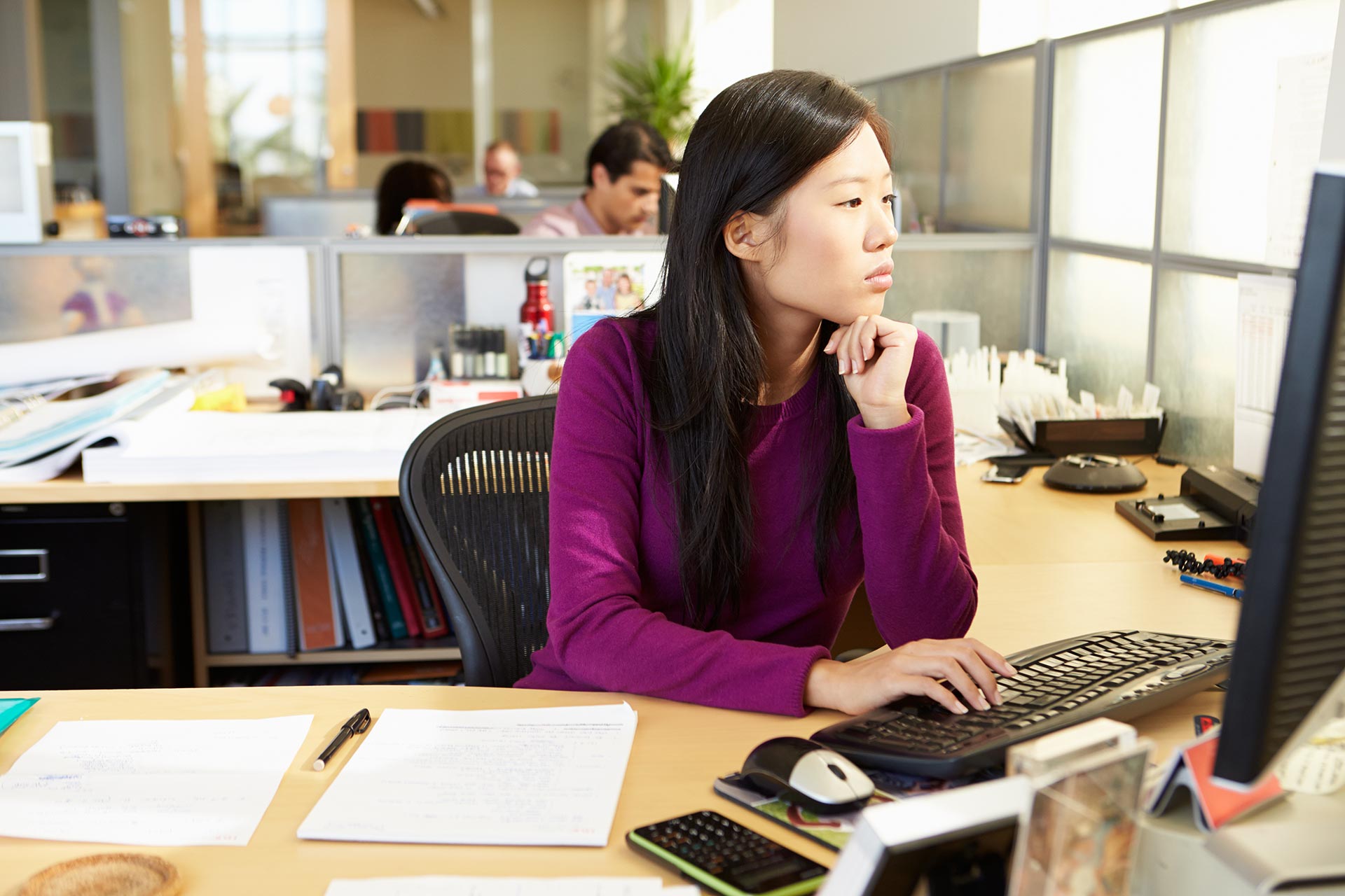 asian-woman-working-at-computer-in-modern-office.jpg