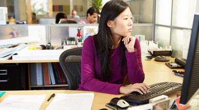 asian-woman-working-at-computer-in-modern-office.jpg