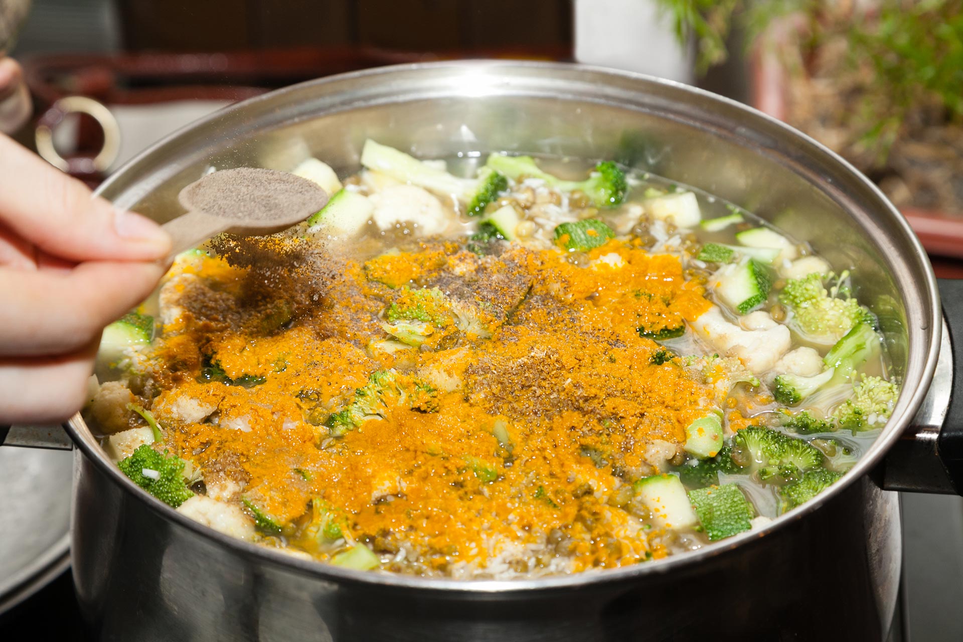adding-spices-to-vegetable-soup.jpg