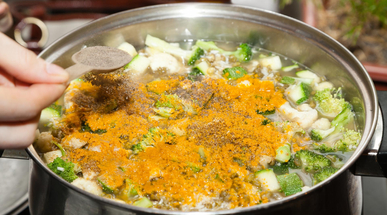 adding-spices-to-vegetable-soup.jpg