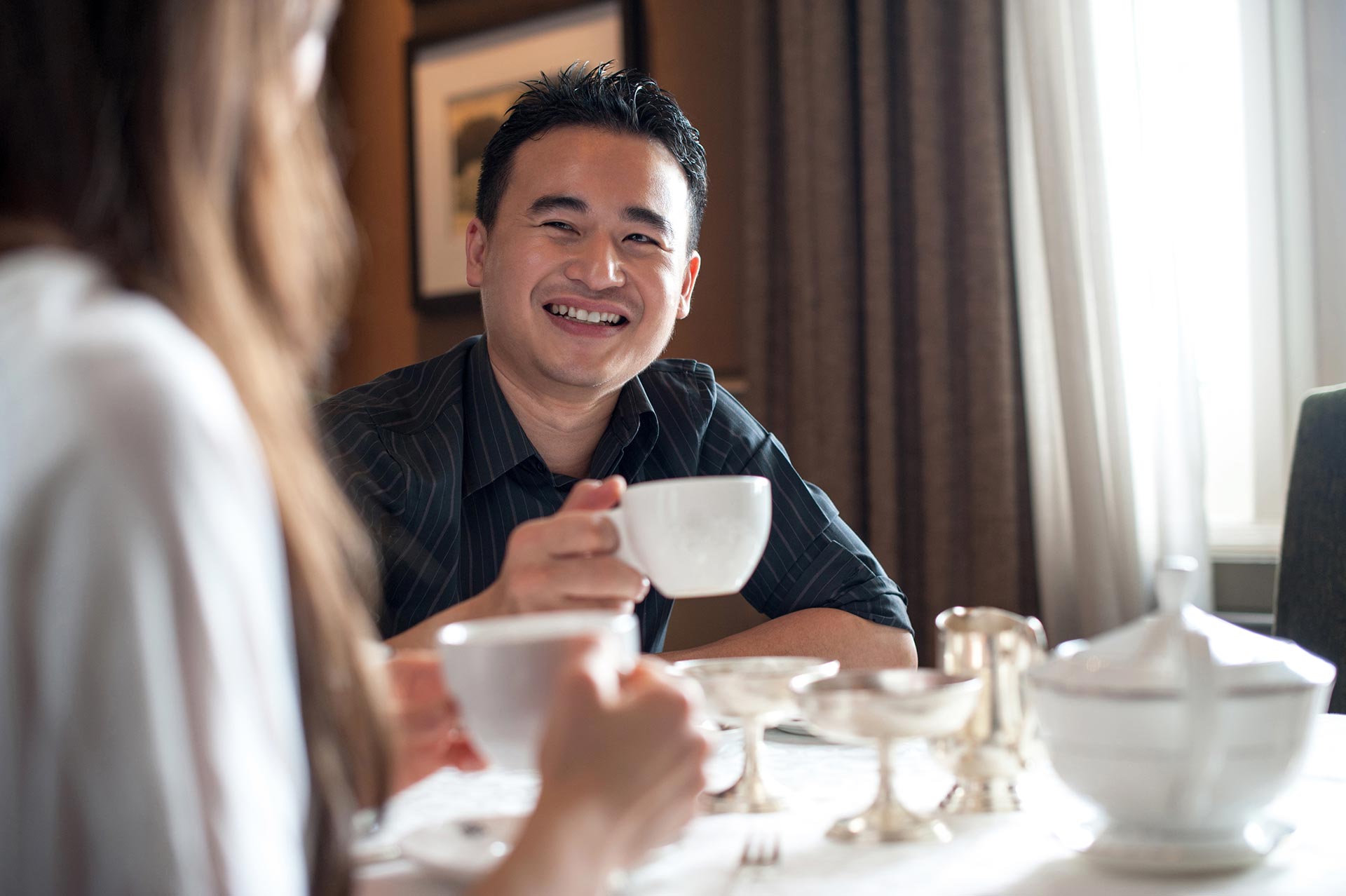 asian-male-at-a-cafe.jpg