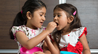 sibling-sharing-food.jpg