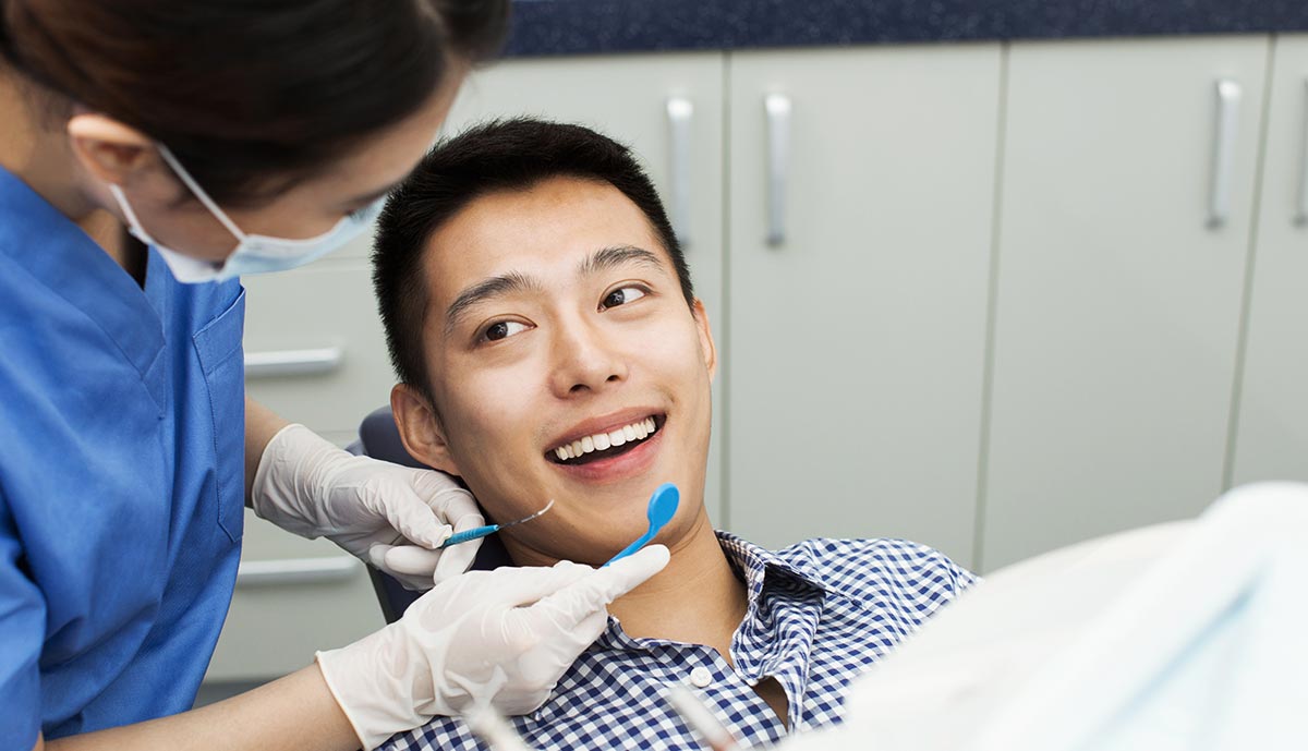 male-patient-recieving-dental-treatment.jpg