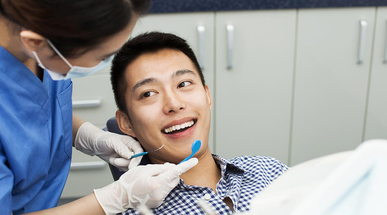 male-patient-recieving-dental-treatment.jpg