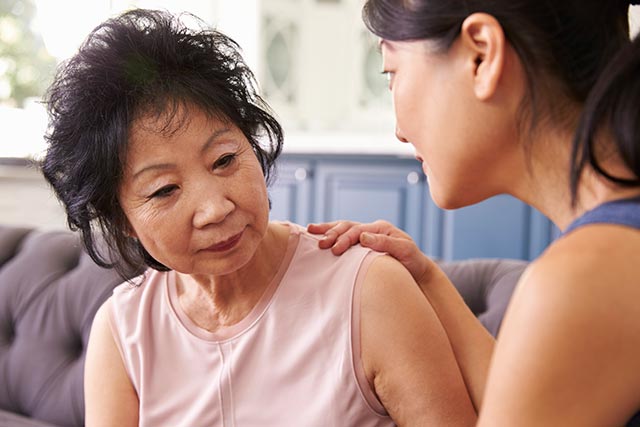 text: A daughter advising her mother on the various stages of Alzheimer’s disease.