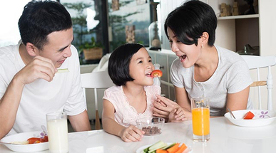 asian-family-eating-a-healthy-snack-at-home.jpg