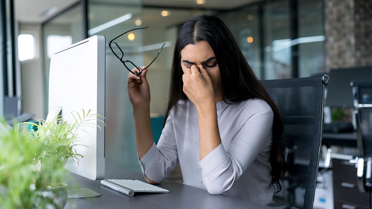 depressed-businesswoman-rubbing-eyes-in-office.jpg