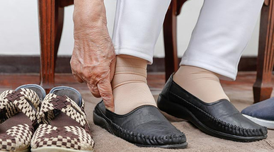 elderly-woman-putting-on-shoes.jpg