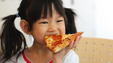 young-girl-eating-pizza.jpg
